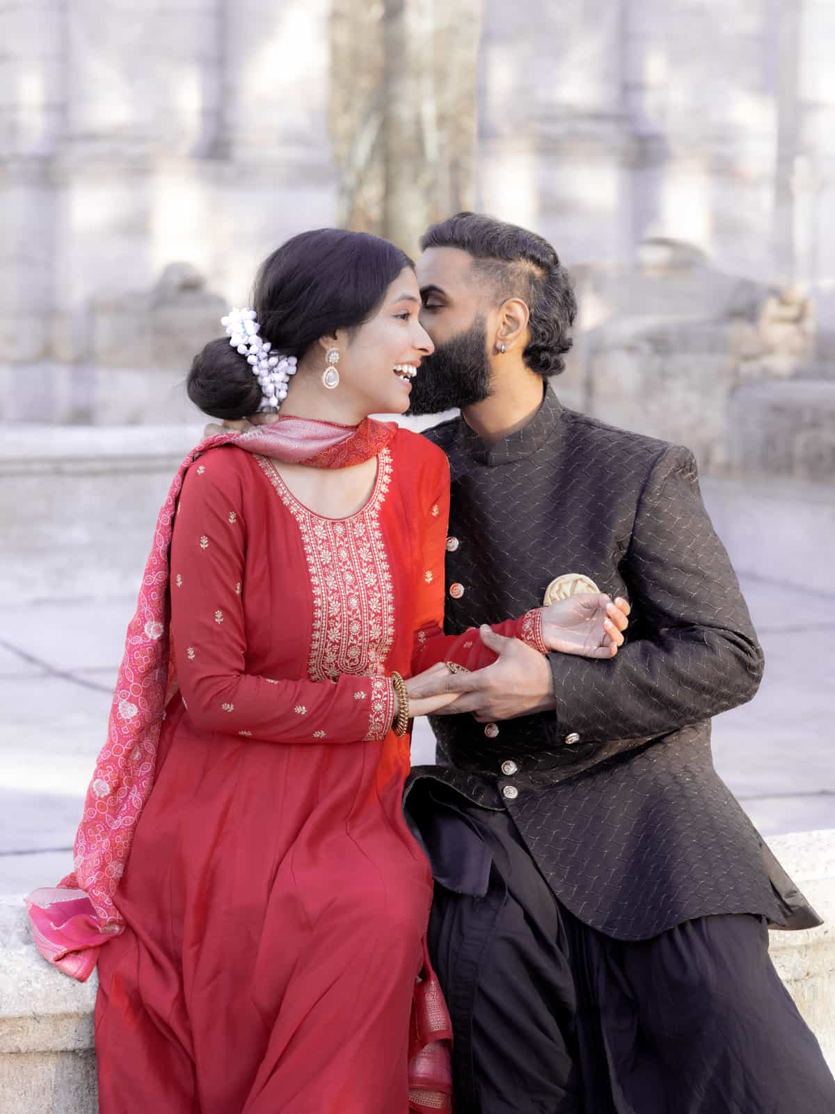 Romantic portrait of Indian bridal couple in warm light