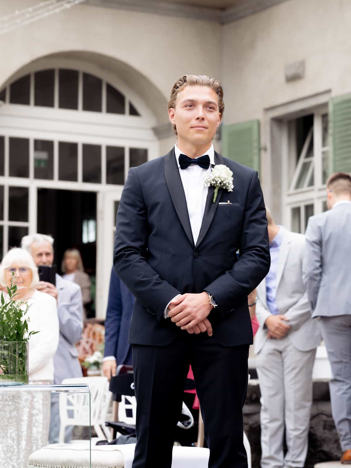 Castle wedding photography Schloss Kartzow - groom in tuxedo before castle facade Berlin Brandenburg
