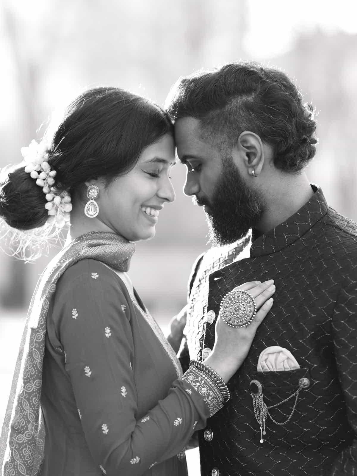 Modern portrait of Indian bridal couple in urban park ambiance