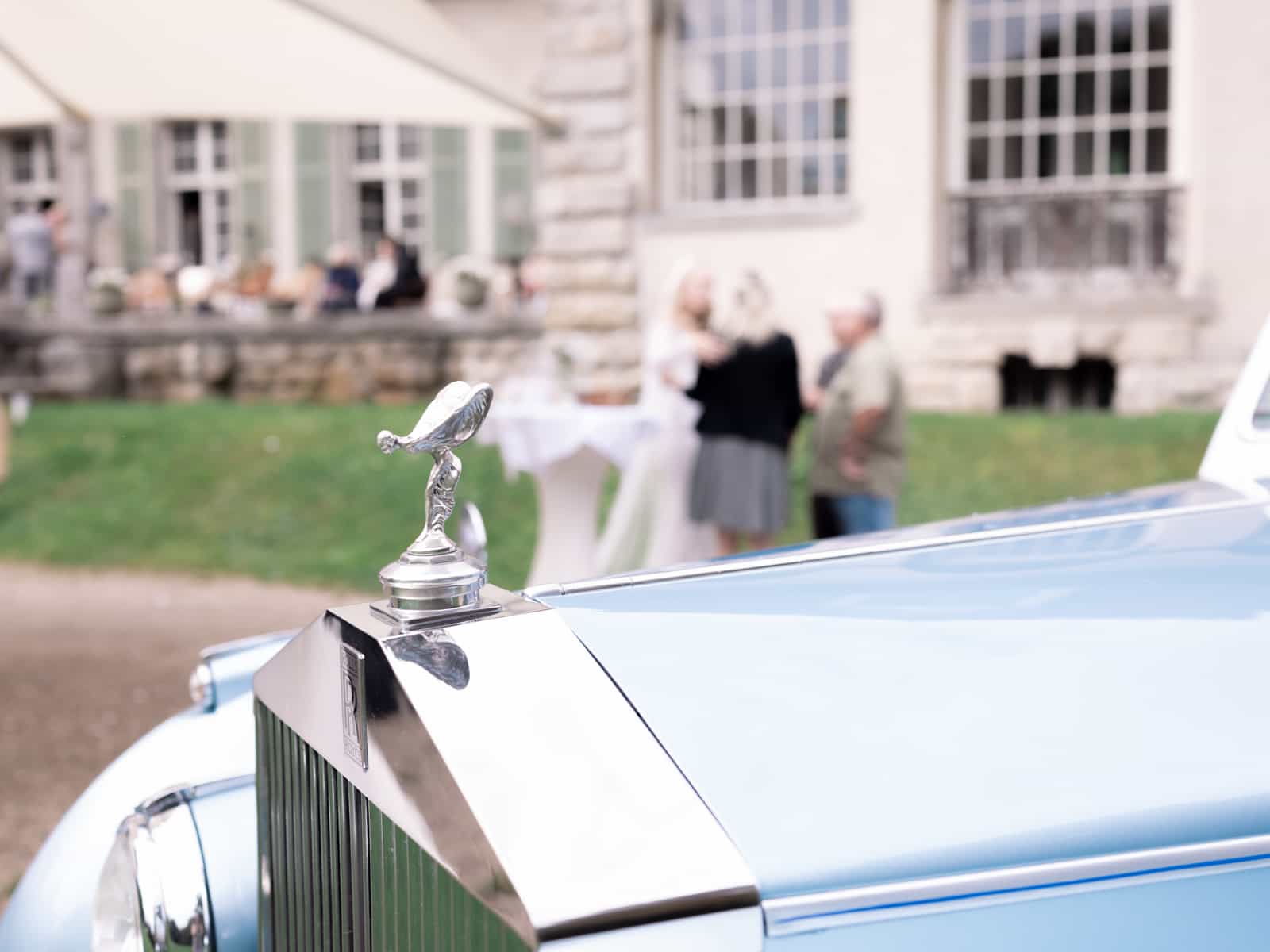 Vintage Rolls Royce hood ornament at elegant Schloss Kartzow castle wedding