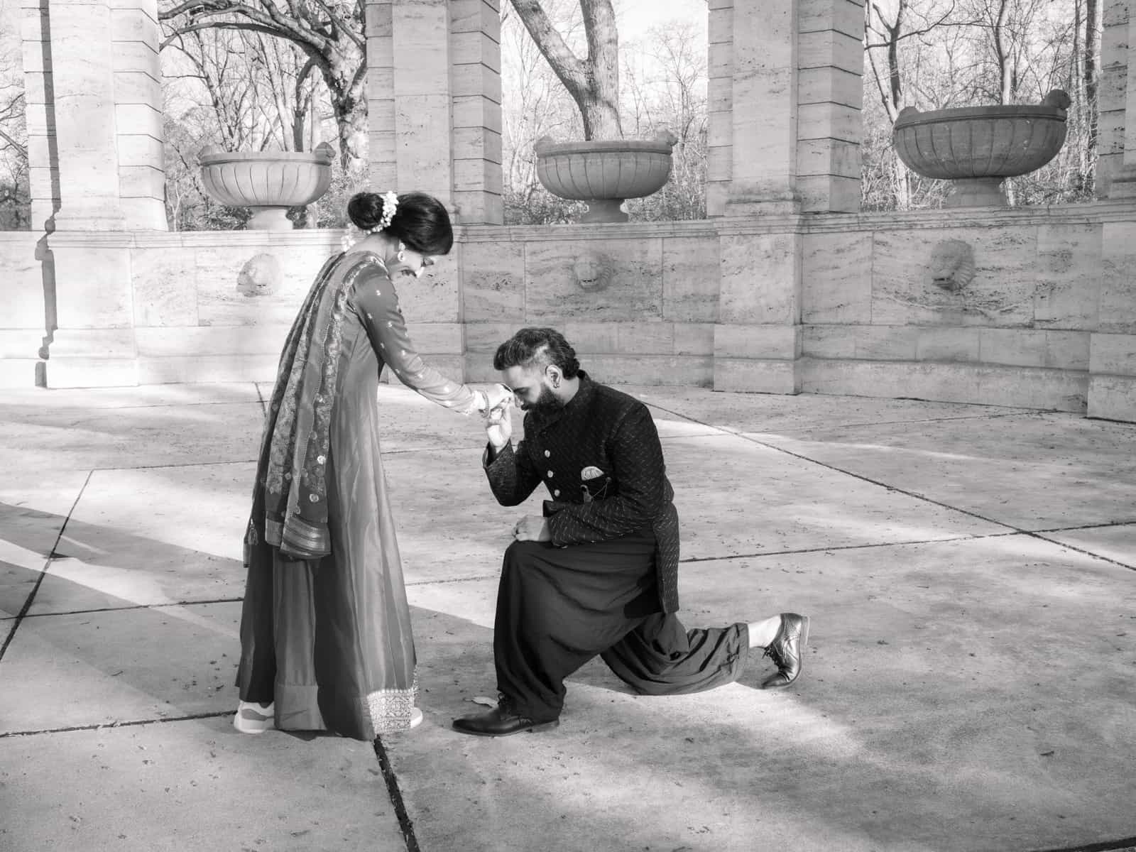 Indian bridal couple in intimate pose with traditional wedding garments
