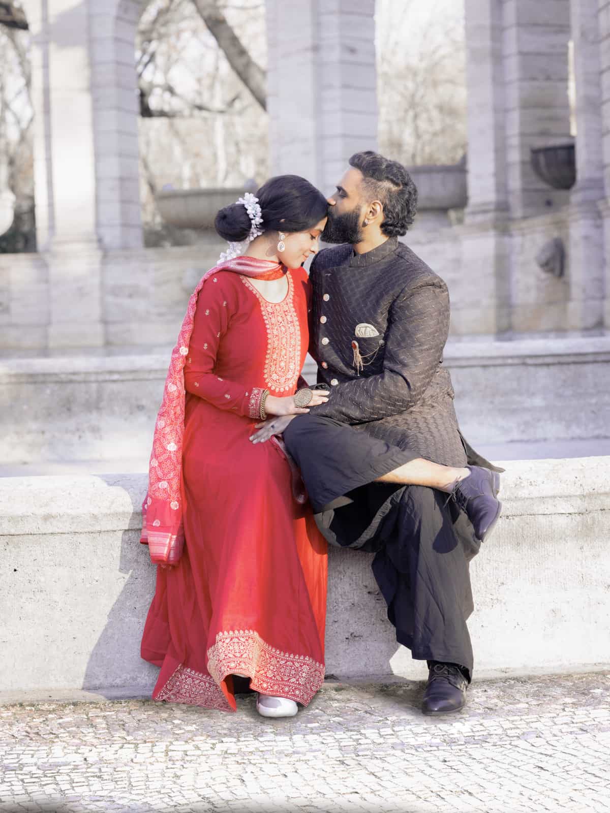 Indian bridal couple on romantic walk through the park