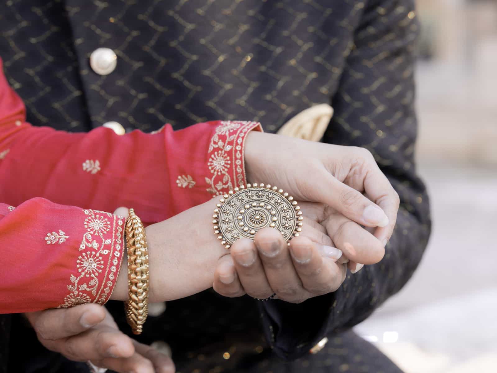 Indian bridal couple in tender embrace with closed eyes