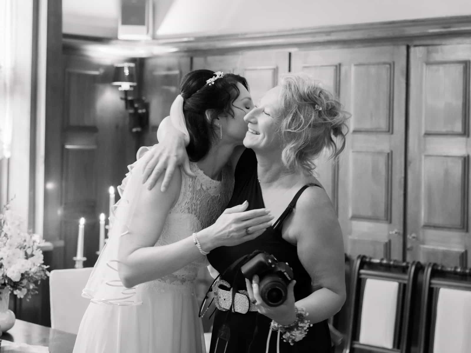 Photographer and bride sharing an emotional moment