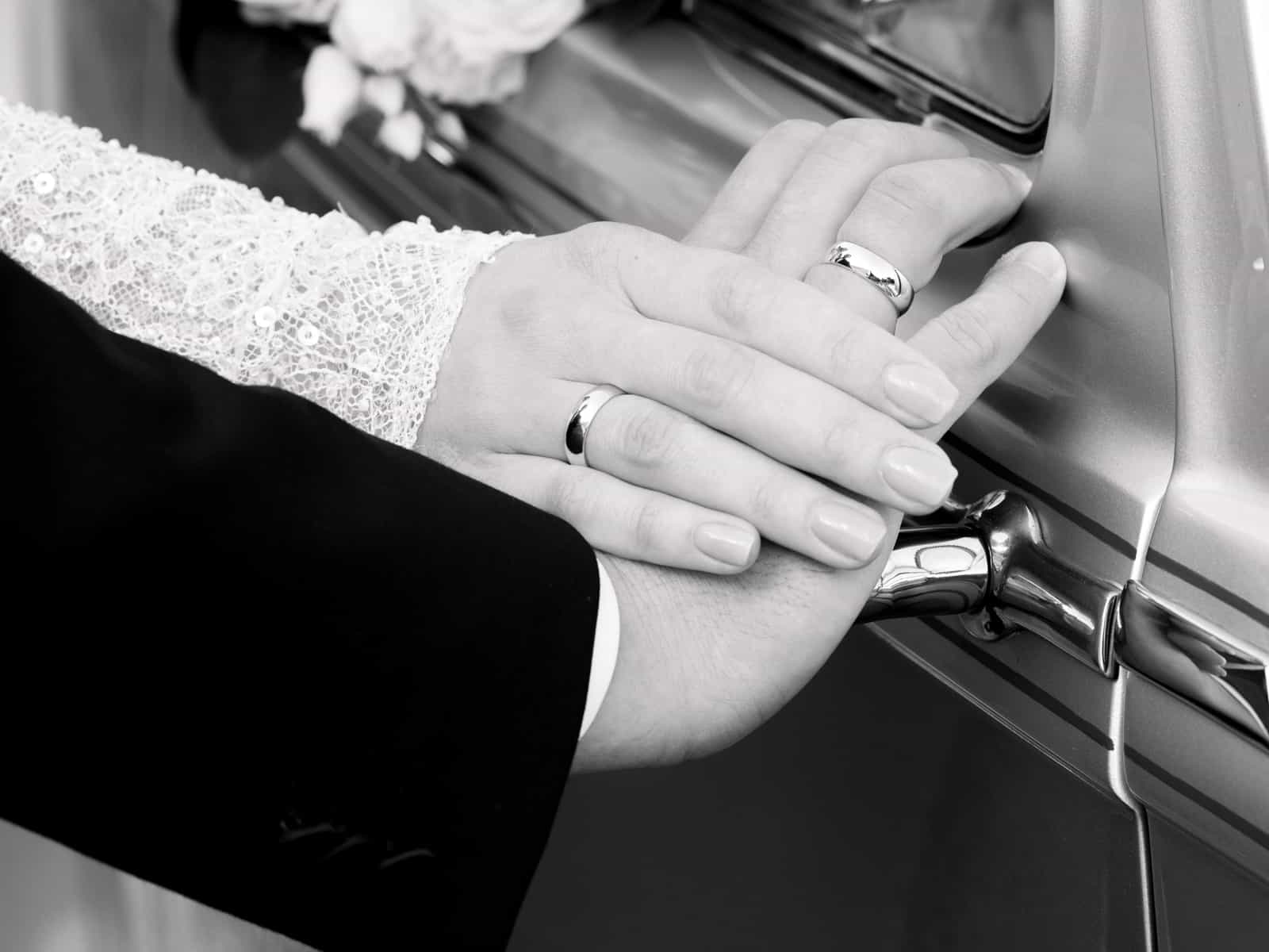 Close-up of wedding rings on vintage car detail at Schloss Kartzow castle wedding
