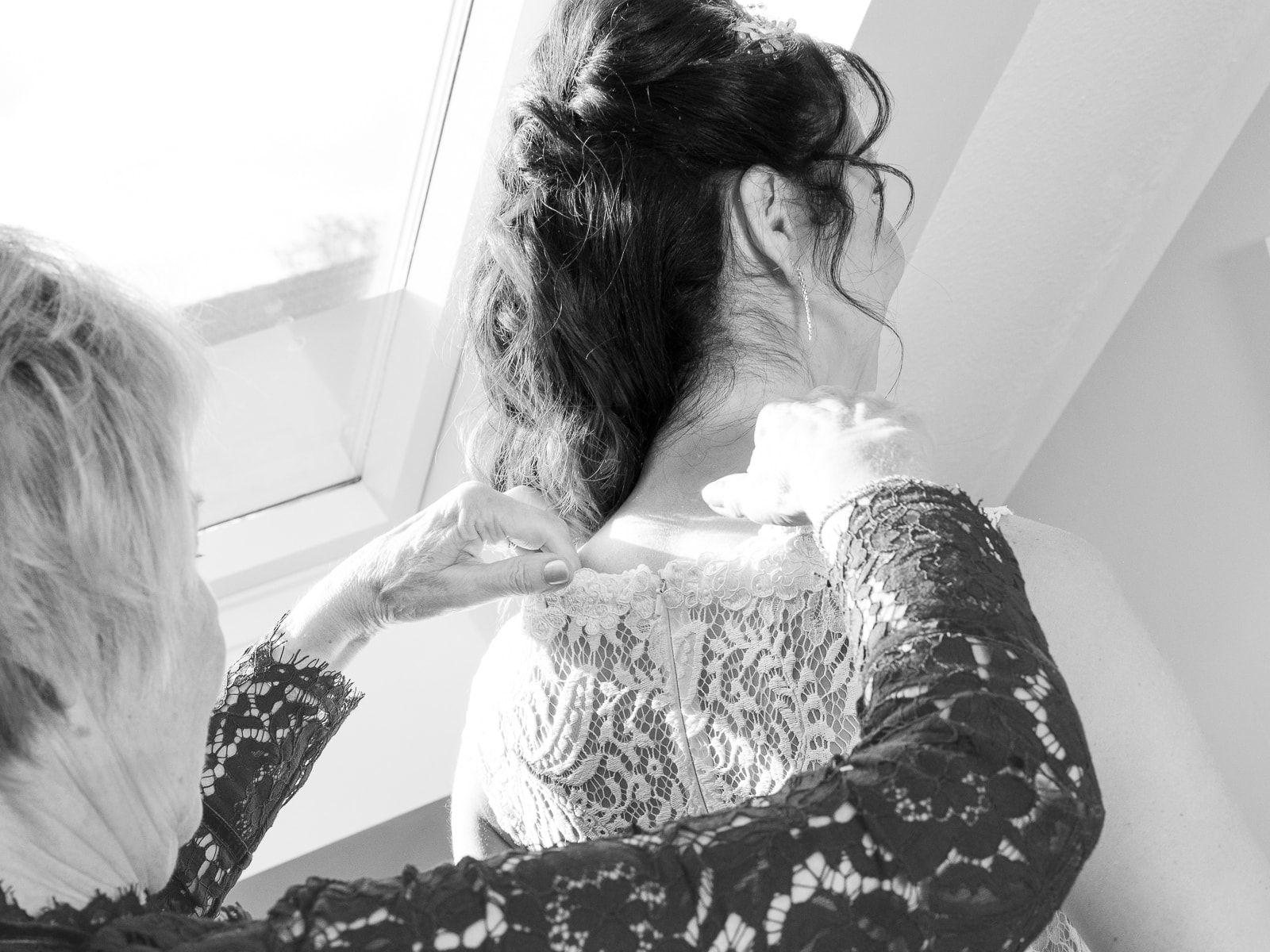 Close-up wedding dress details during preparations