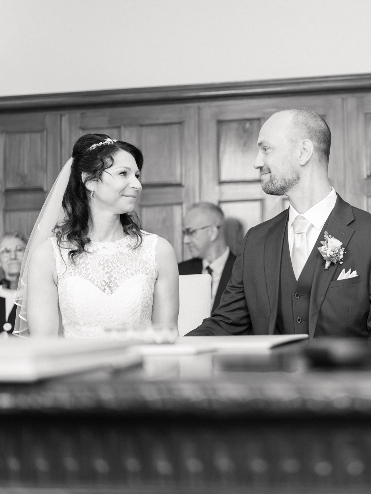 Couple looking lovingly at each other during civil ceremony