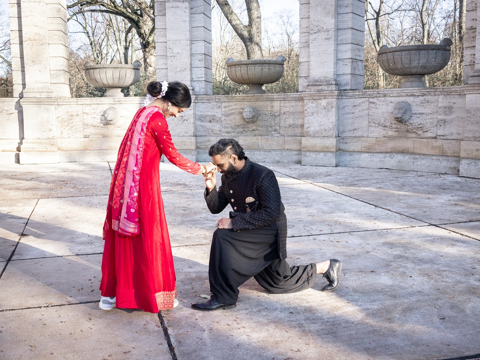 Indian bridal couple in intimate pose with traditional wedding garments