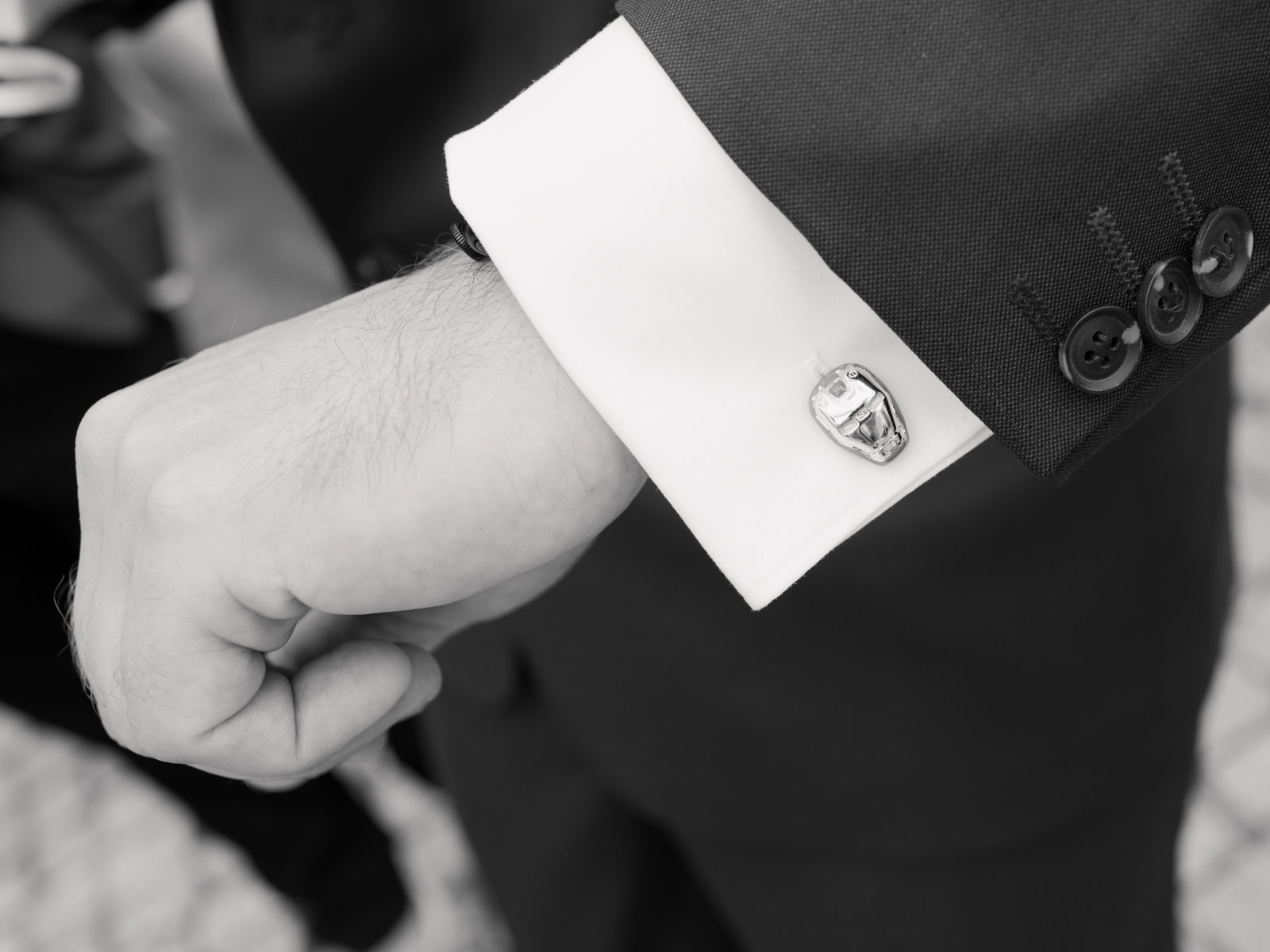 Iron Man cufflink on groom's shirt