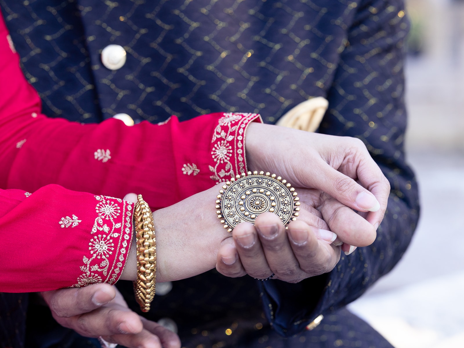 Indian bridal couple in tender embrace with closed eyes