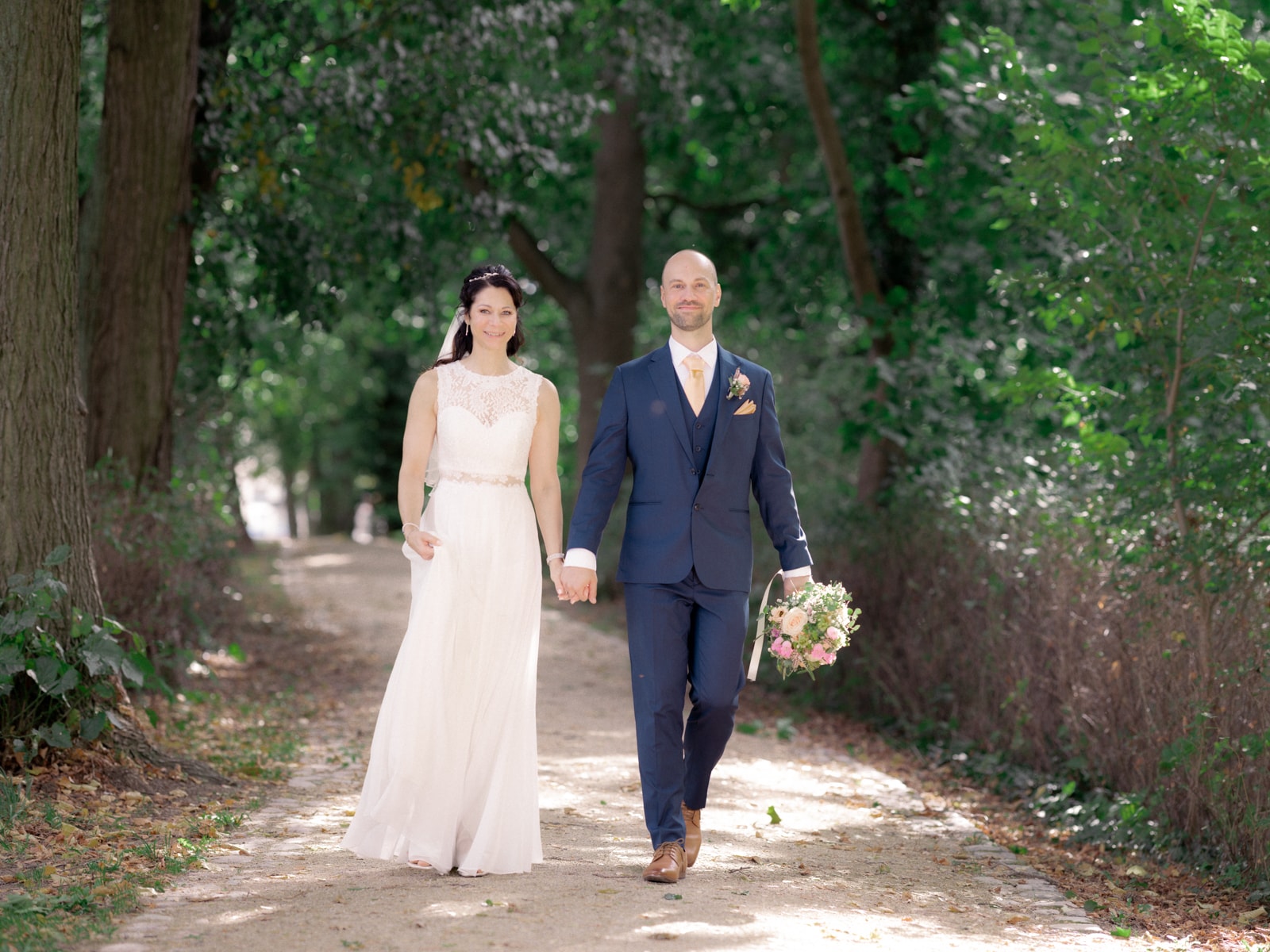 Couple on romantic walk under trees