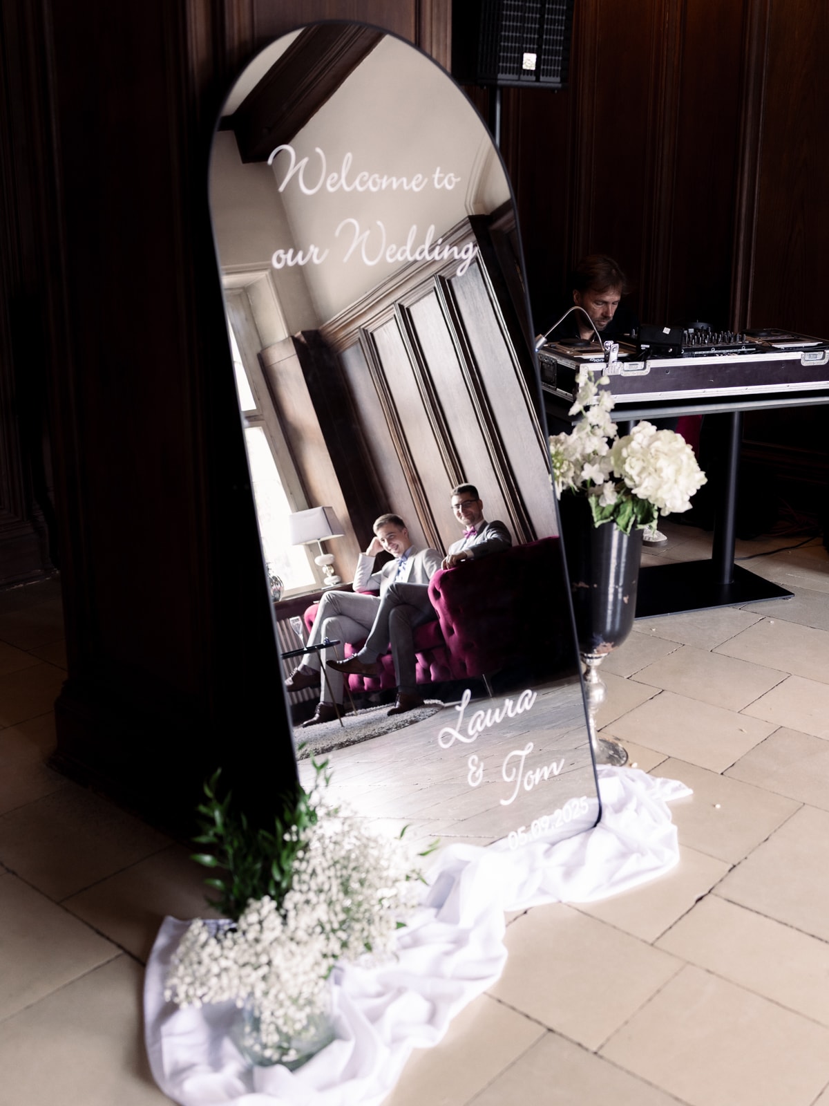 Personalized welcome mirror with floral decoration at Schloss Kartzow castle wedding